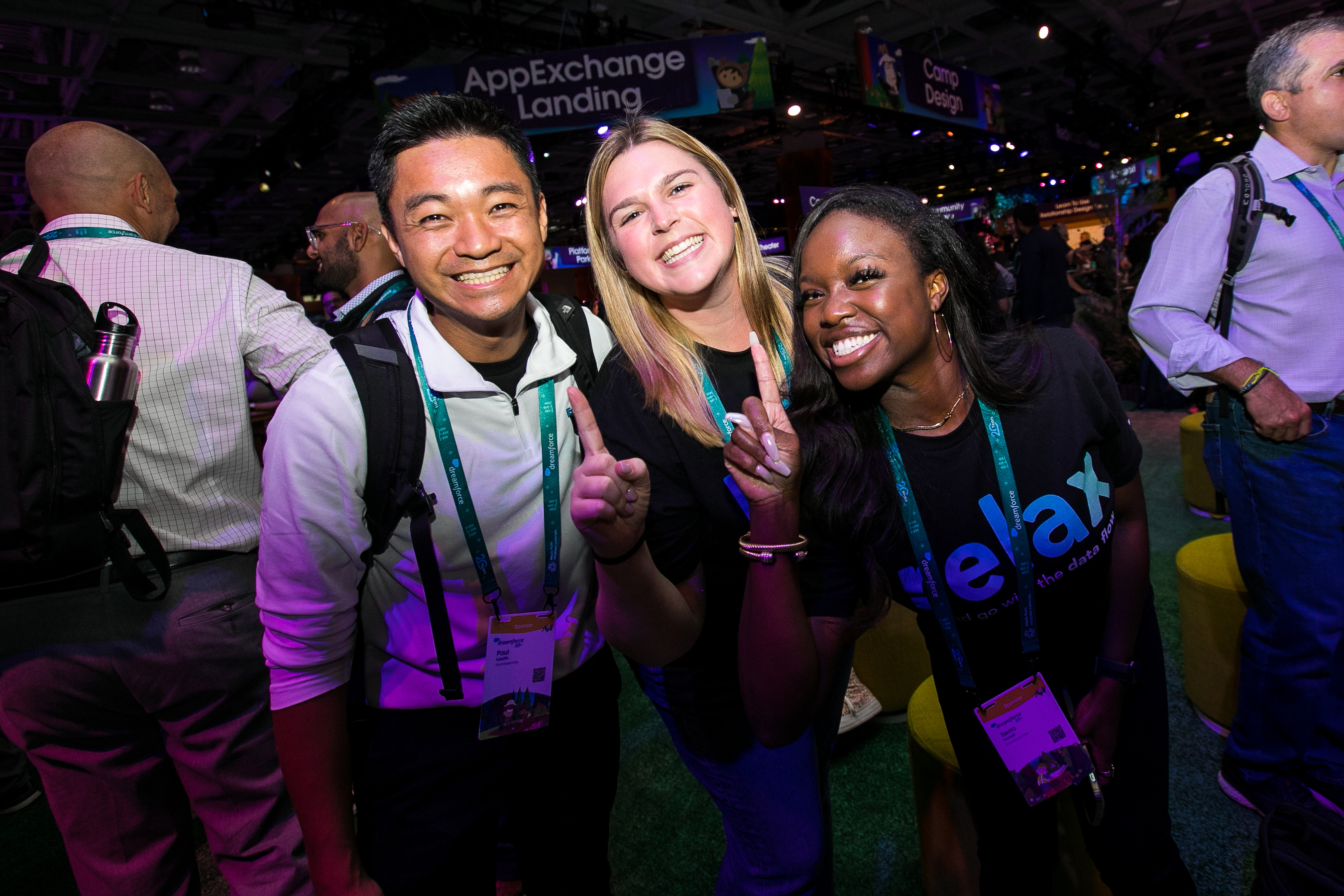 A group of friends pose for a photo at a Dreamforce 2022 event. 